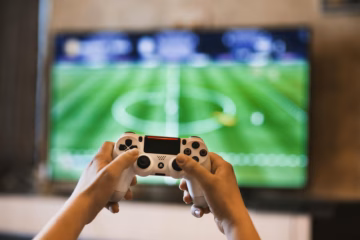 person holding game pad